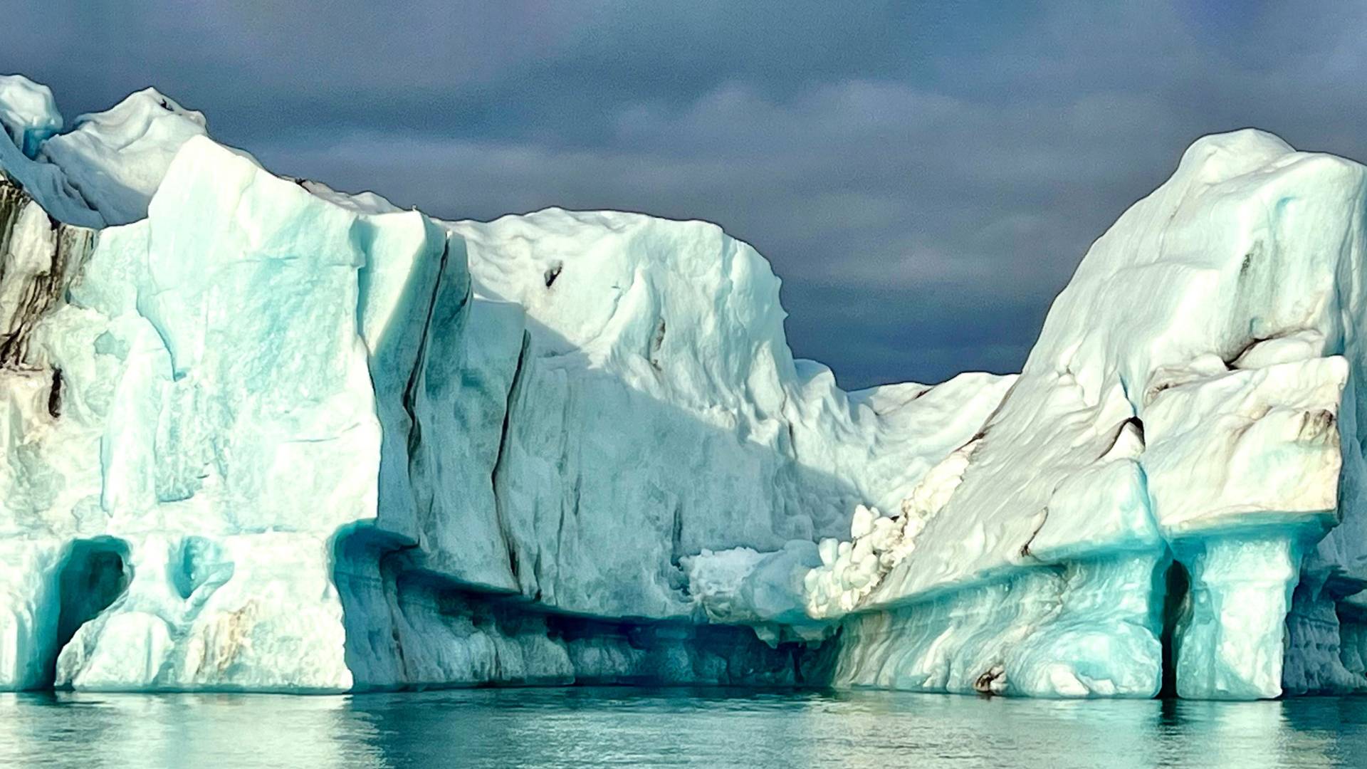 An iceberg calved off a retreating glacier floats in Jökulsárlón Glacial Lagoon.