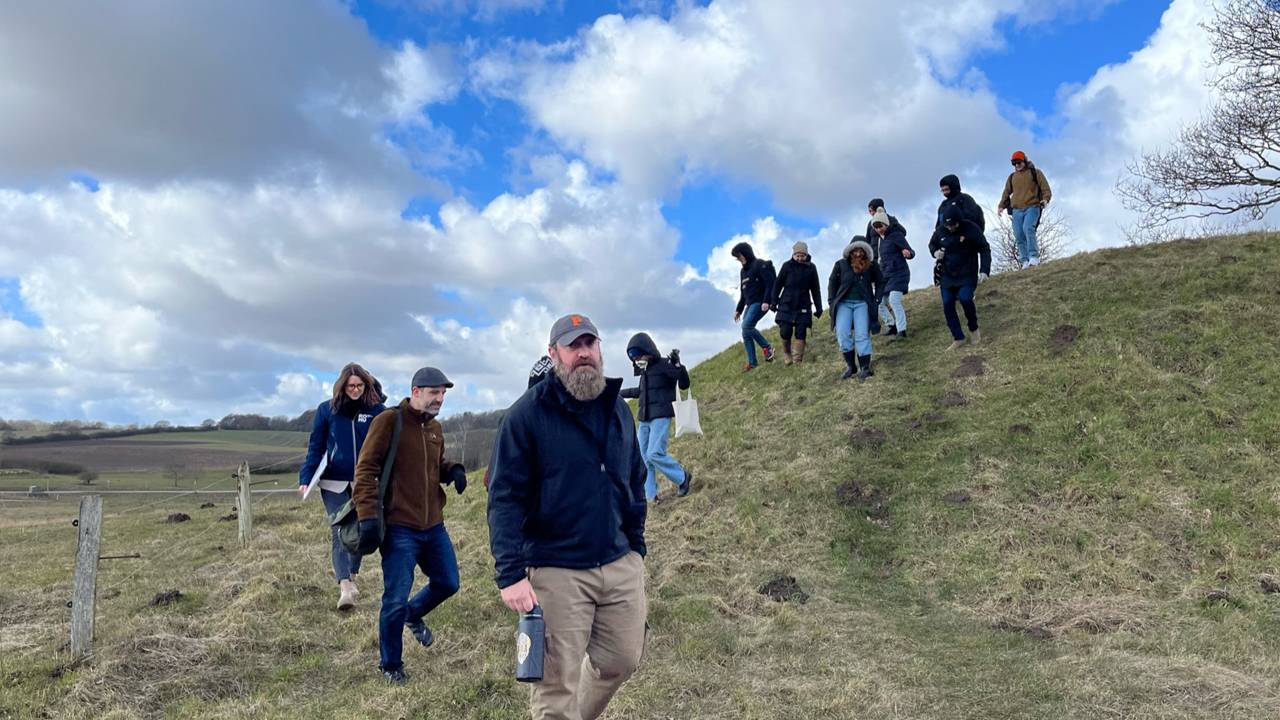 Students walk down a steep hill in Denmark