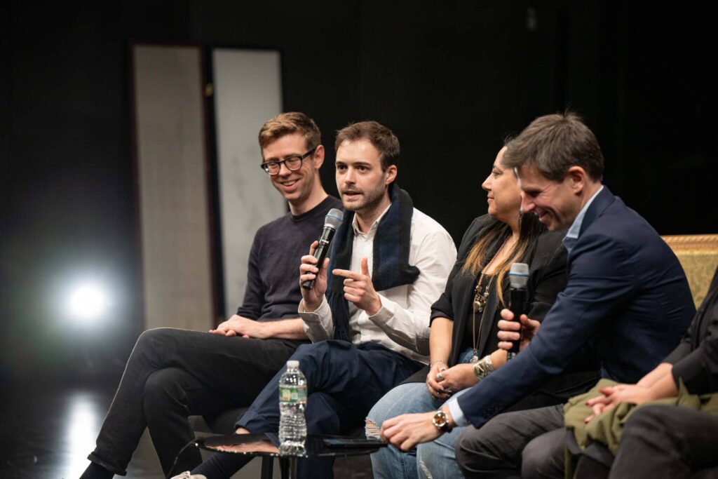 Four people participating in a panel discussion