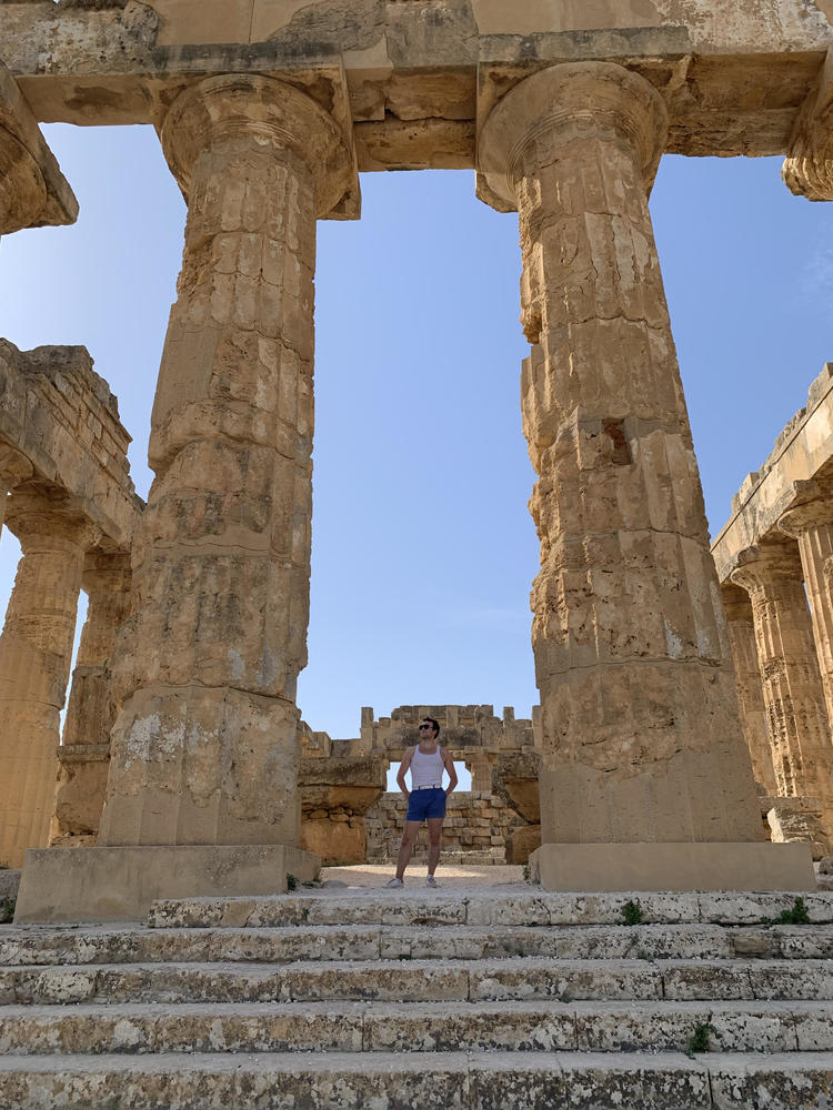 John Freeman standing in the Greek temple at Selinunte, Sicily