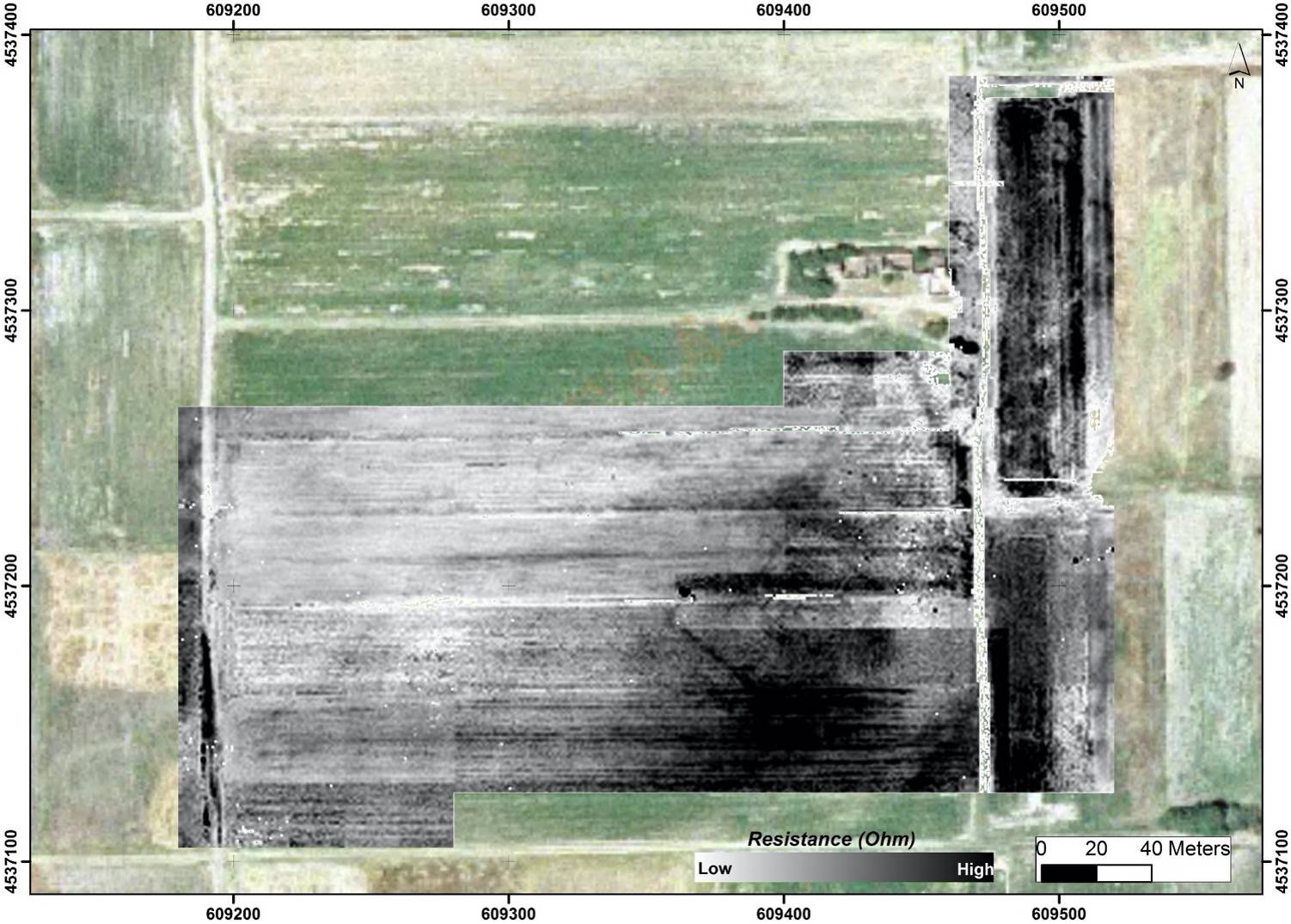 A field that has been scanned with LiDAR, some areas are green to show vegetation, others are light gray, to dark gray to show underground architecture and objects.