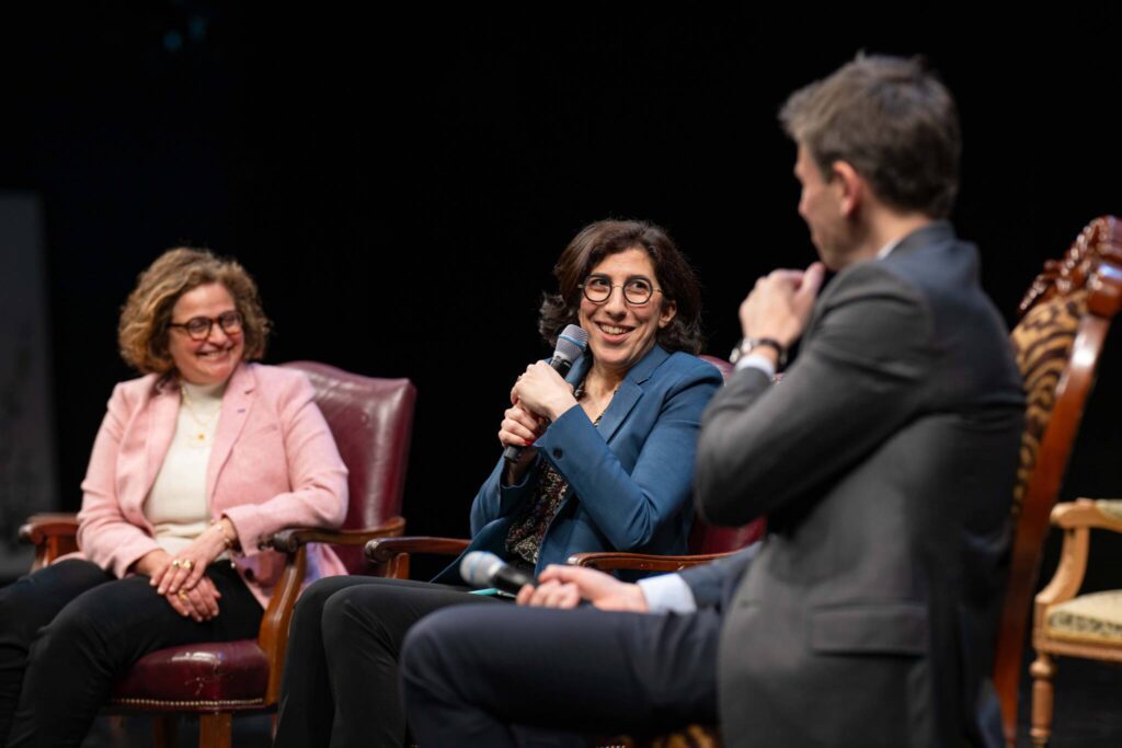 Three people participating in a panel discussion