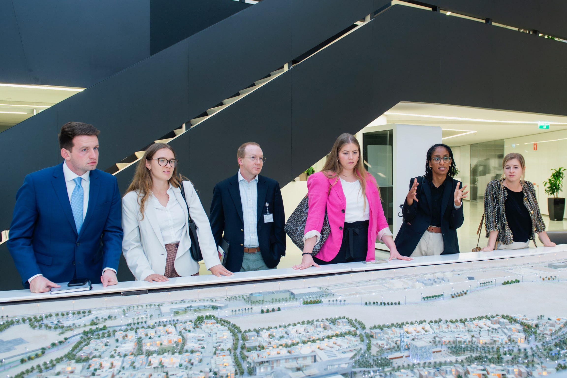 SPIA students looking at a map of proposed urban city planning