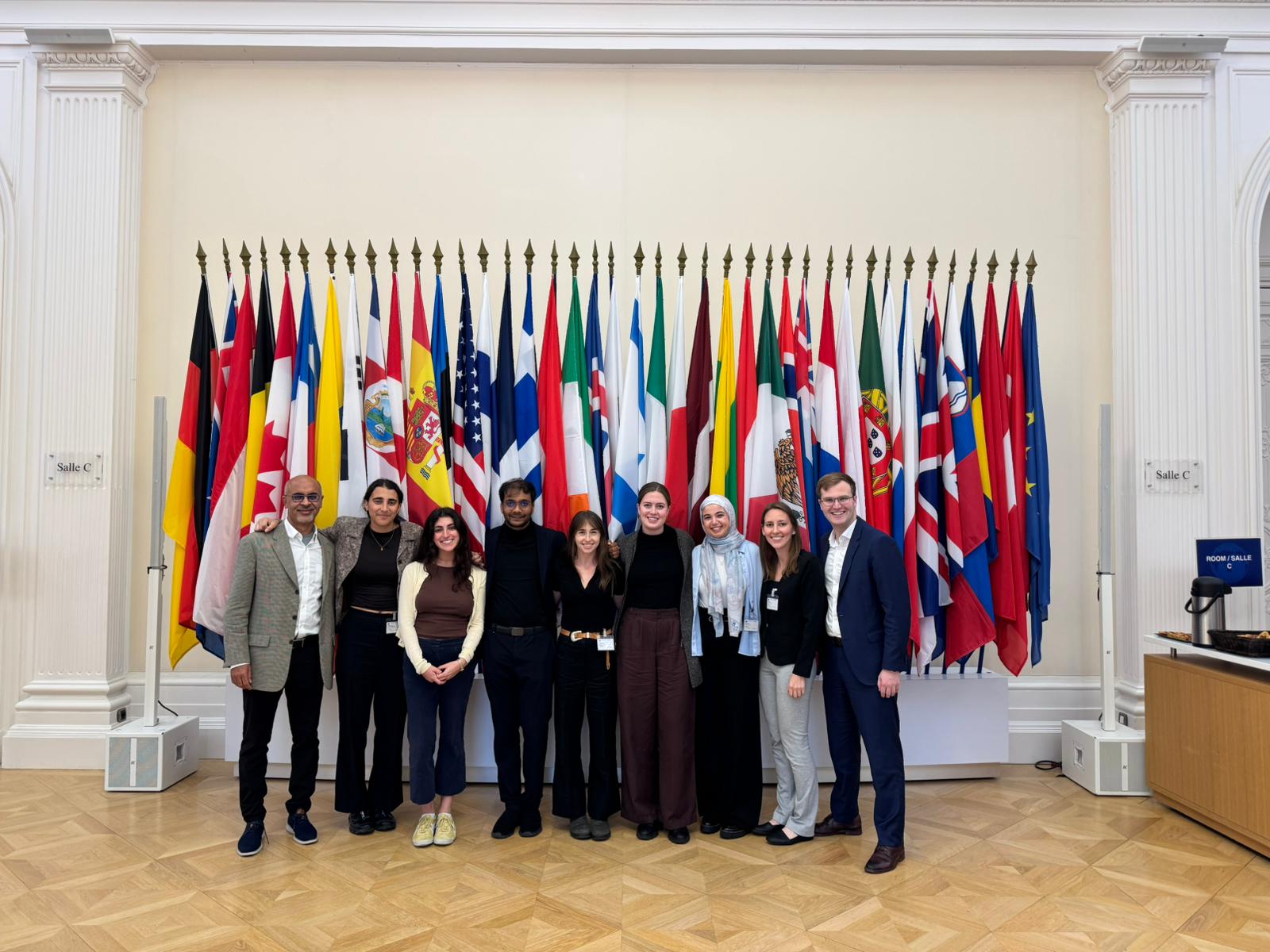 An image of SPIA students together behind 30 European flags