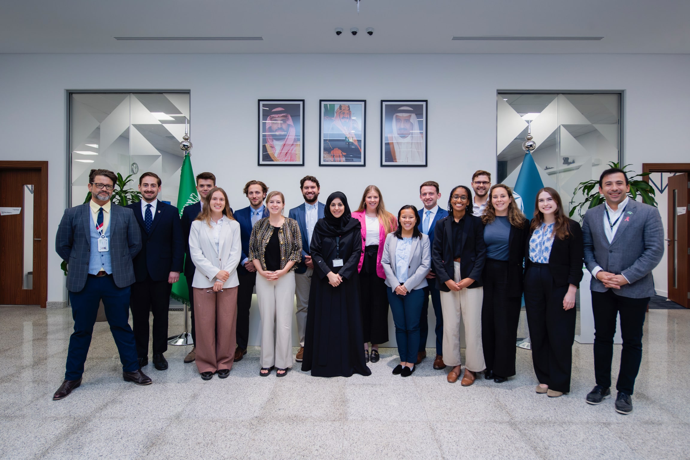 SPIA students dressed in suits behind images of the Saudi Arabia Royal Crown Prince