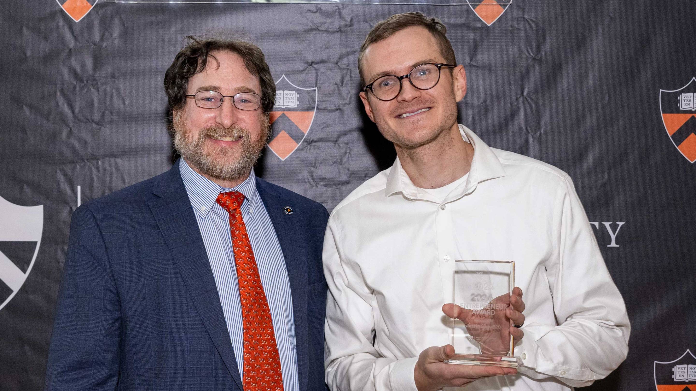 Craig Arnold and Justin Silpe pose for a photo after Arnold presented Silpe the Tiger Entrepreneur Award.