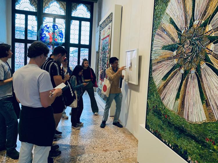 Students discussing the artist Shahzia Sikander’s work at her exhibition