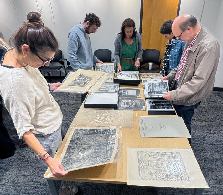 Participants examine documents