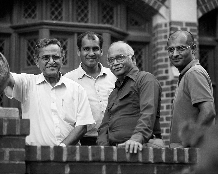 A group of four Indian men outside a Princeton building