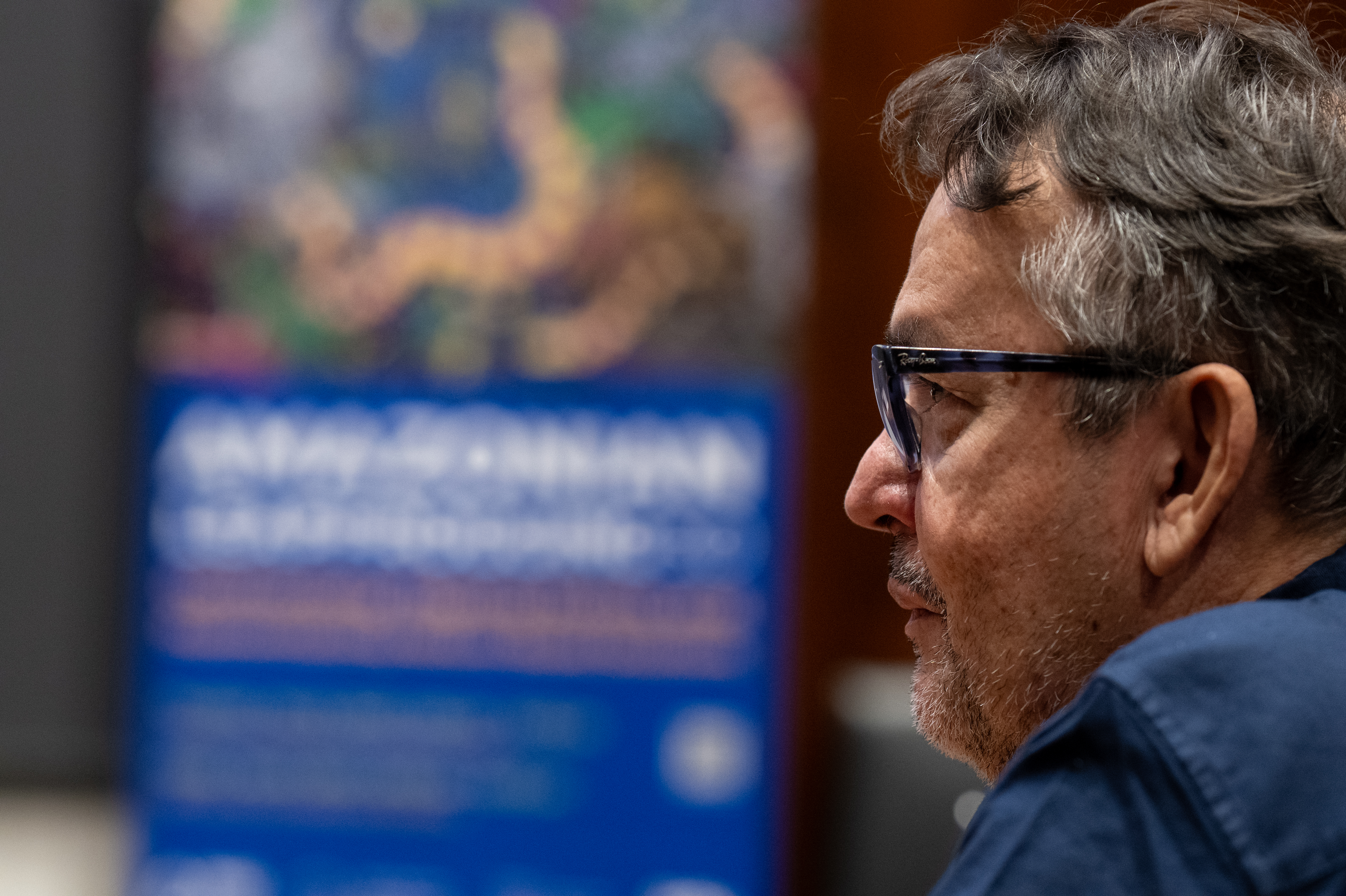 Close up of a conference goer listening to a presentation