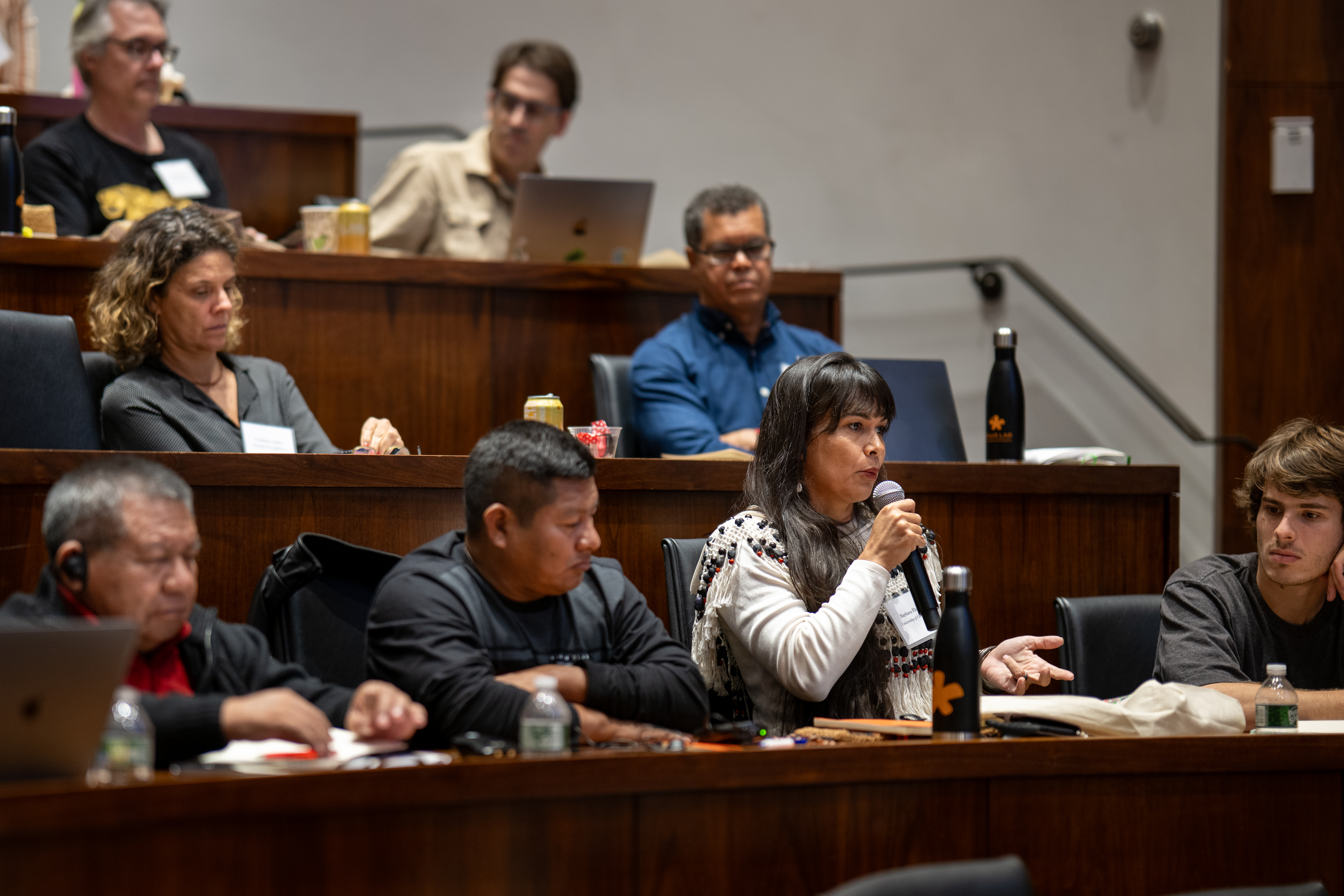 An audience member asks a question of a presenter.