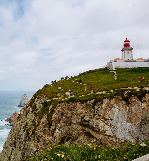  a lighthouse overlooking a Portuguese seascape
