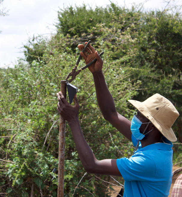 scientist working with tong