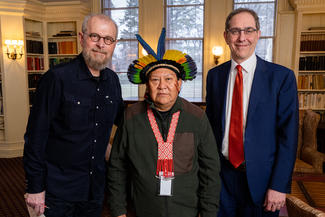Prof. Joao Biehl, indigenous leader Davi Kopanawa, and President Chris Eisgruber pose for a photo in Prospect house.