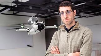 Michael Soskind, first author and graduate student in electrical and computer engineering, photographed with the drone in a lab setting
