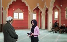 Fizza Arshad (center) interviews Amir Aziz, the imam of the Berlin Mosque, also known as Ahmadiyya Mosque, who emigrated from Pakistan in 2016. 