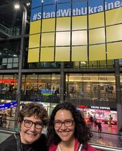 Deborah Amos (left), Ferris Professor of Journalism in Residence, and Delphine Lourtau, a human rights lawyer who helped Amos organize the weeklong trip, in Berlin’s Central Train Station.