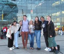 At Berlin Central Train Station, students meet with Zara Raimbek (second from left) and Marielle Tierney (center), volunteers from Berlin Arrival Support who have been assisting Ukrainian refugees