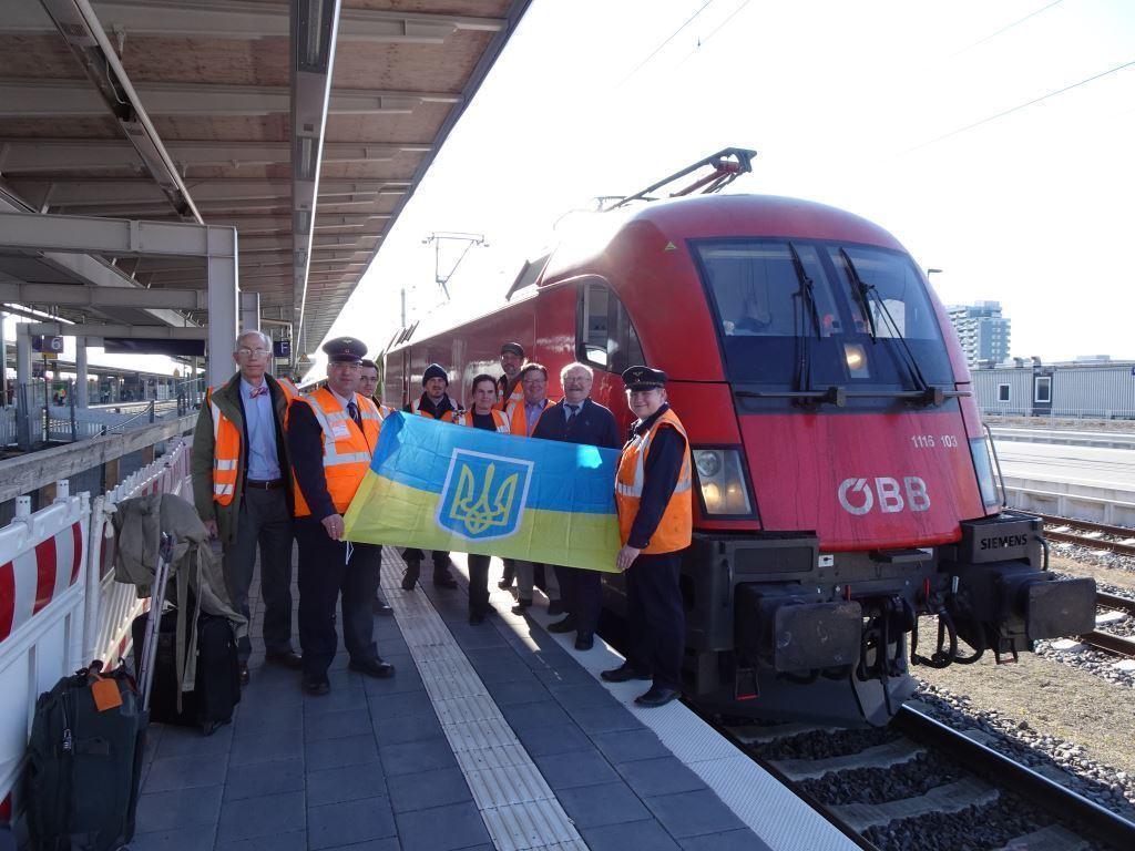 RDC employees proudly pose with the Ukrainian flag as they await their passengers. 