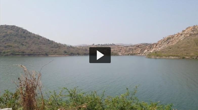 India landscape photo with video play button