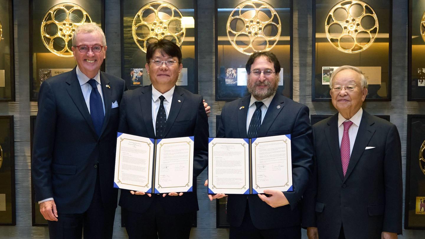 New Jersey Gov. Phil Murphy and Princeton Vice Dean for Innovation Craig Arnold (center right) pose with CJ Corp. Chief Digital Officer and Head of CJ AI Center Lee Chi-hoon (center left) and the chairman of CJ Group, Sohn Kyung-Shik, holding the memorandum of understanding for research that both groups jointly signed.