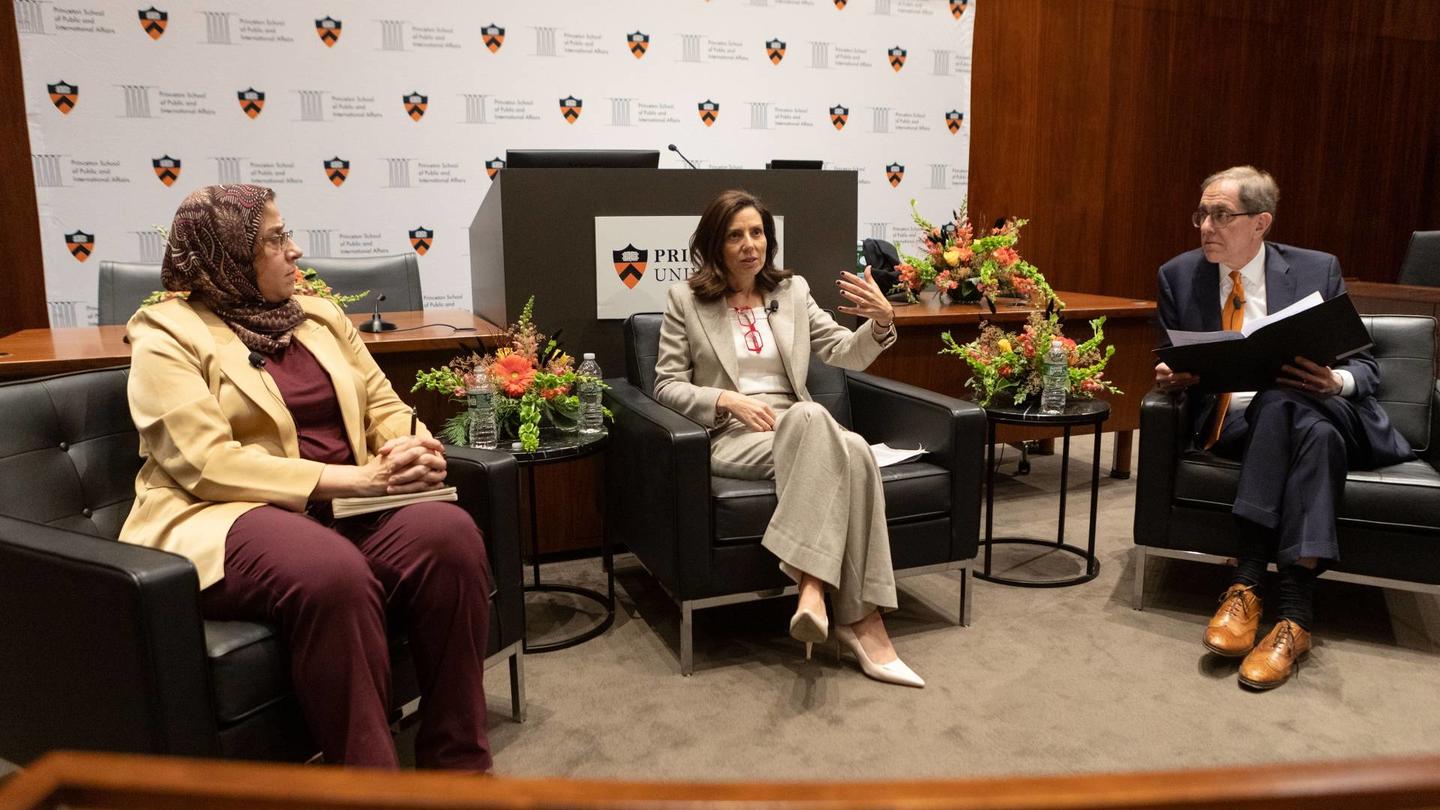 Amaney Jamal (left), dean of Princeton’s School of Public and International Affairs, and Keren Yarhi-Milo (center), dean of Columbia’s School of International and Public Affairs, talk with Princeton President Christopher L. Eisgruber (right) during a Nov. 28 conversation on Princeton’s campus.
