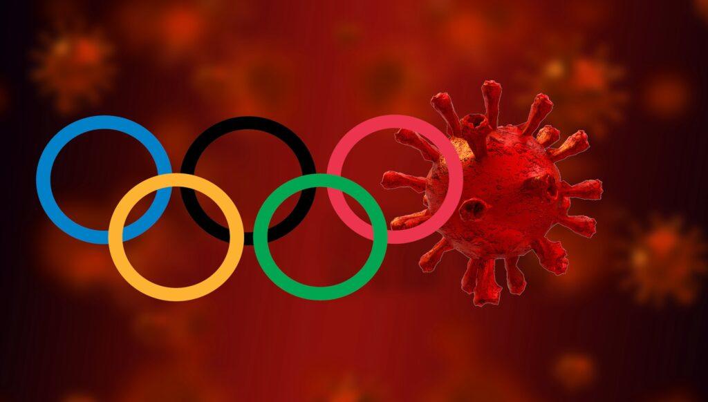 A graphic with a covid cell in the place of one of the olympic rings from the olympic logo