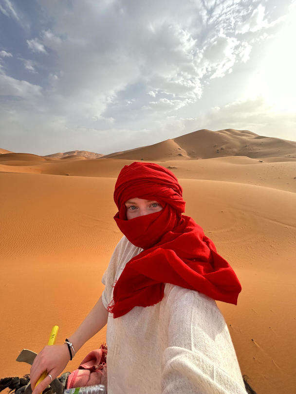 Student Danielle Bejerano atop a camel during her experience abroad in Morocco.
