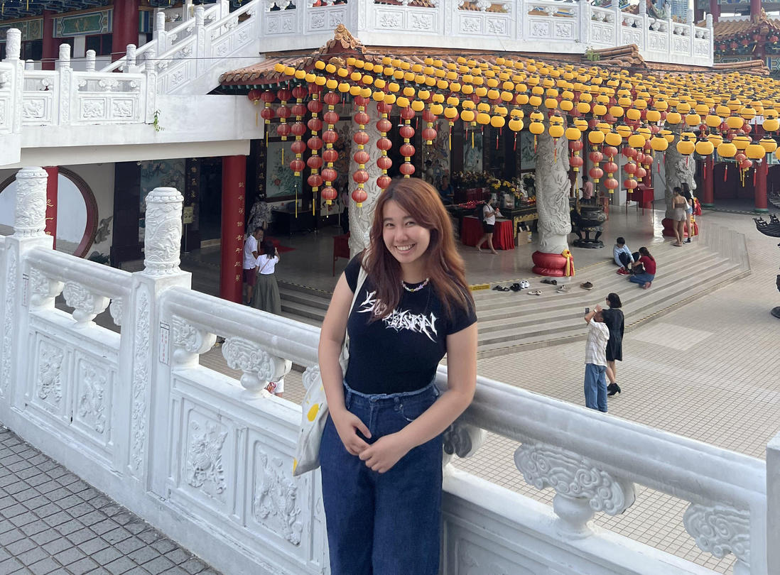 Laura Zhang in front of a temple located in Kuala Lumpur