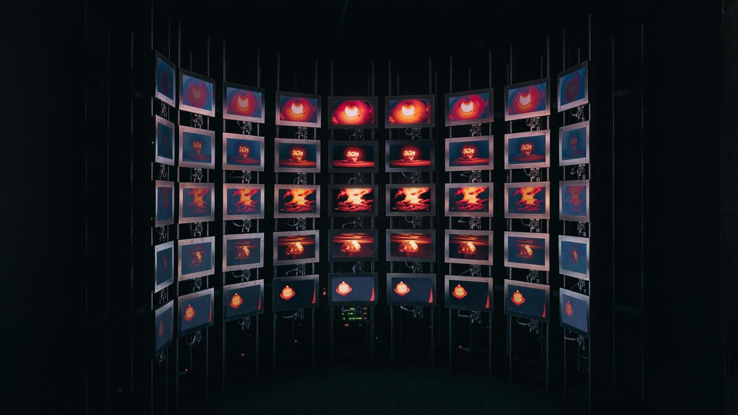 Multiple LCD screens in a pattern showing different timings of the same bomb detonating