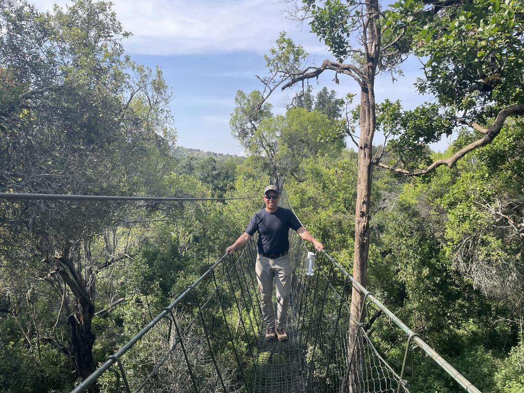 Brian Kloeppel on a forest-canopy walkway at teh Ngare Ndare Trust in Kenya. Photo by Kelsie Rouse