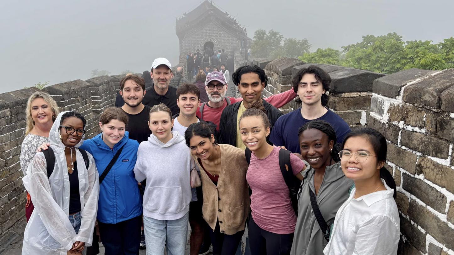 SPIA students smiling on the Great Wall of China