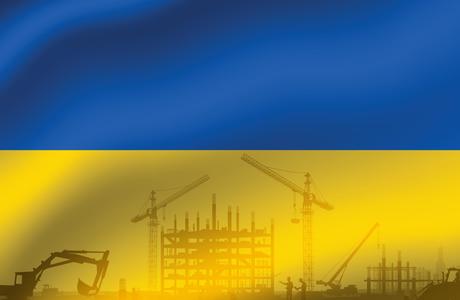a ukrainian flag with construction machinery silhouetted on it 