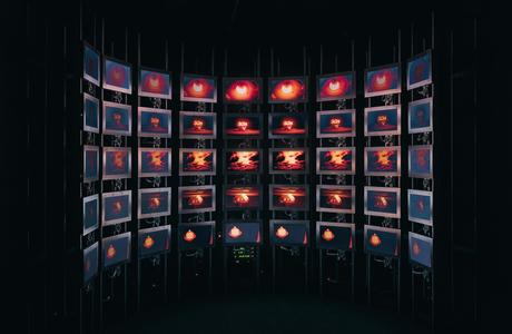 Multiple LCD screens in a pattern showing different timings of the same bomb detonating
