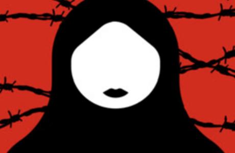 An image of a women wearing a hijab behind a red background and black barbed wire