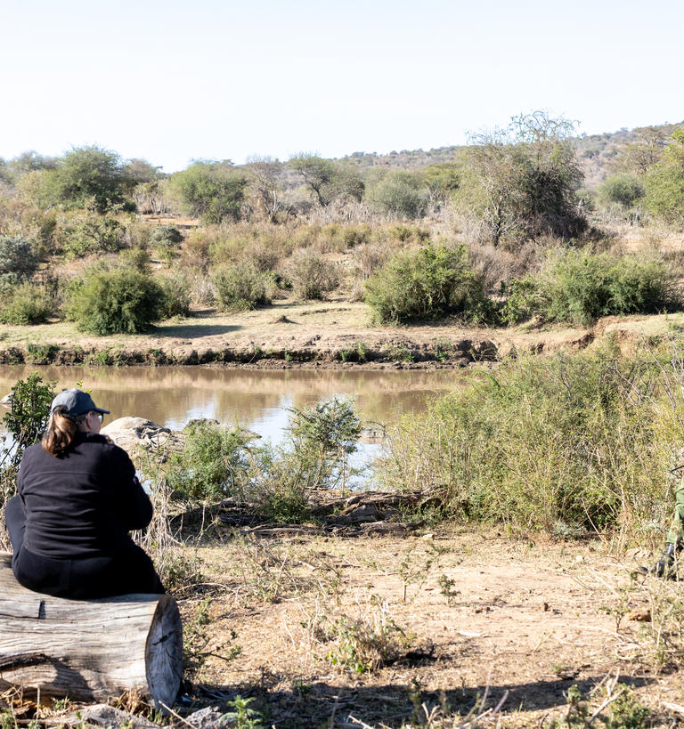 two people against the savannah backdrop