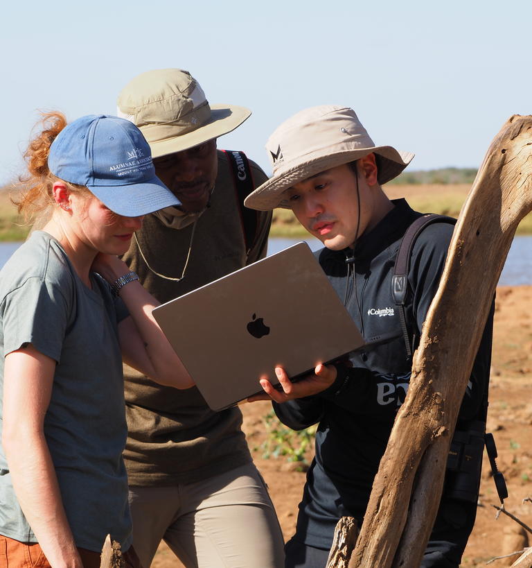 Researchers looking a computer